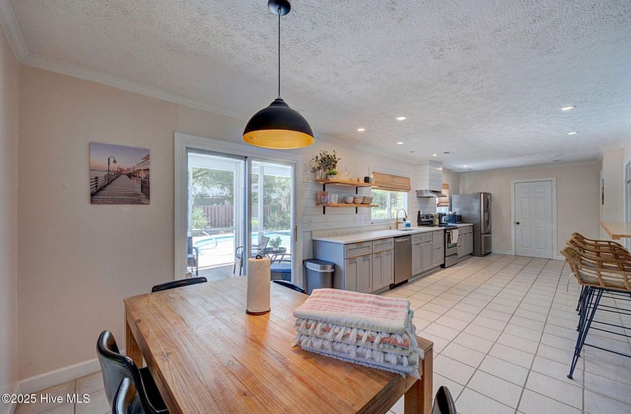 Open, fully equipped kitchen with modern appliances and plenty of counter space, seamlessly connected to the living area for easy cooking and gathering.