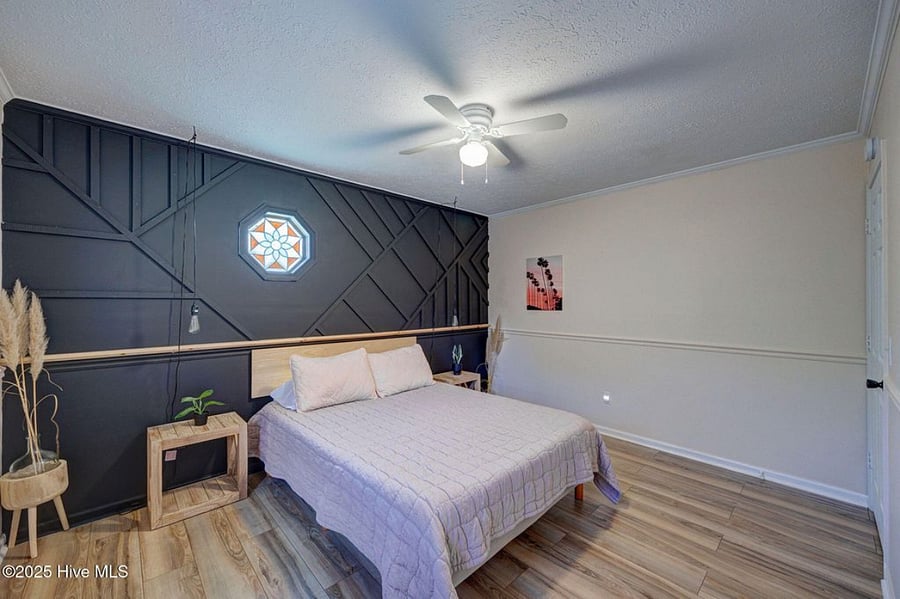 Queen bedroom offers a stylish and cozy retreat for restful nights.