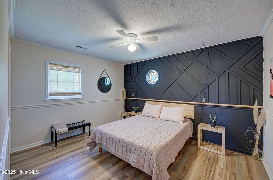 Queen bedroom offers a stylish and cozy retreat for restful nights.