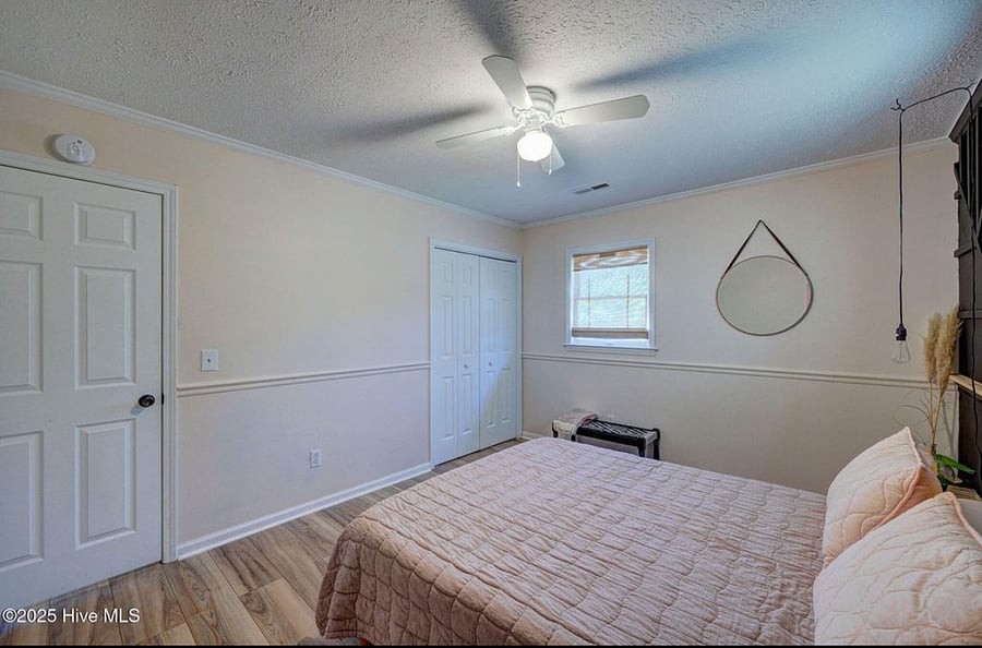 Queen bedroom offers a stylish and cozy retreat for restful nights.