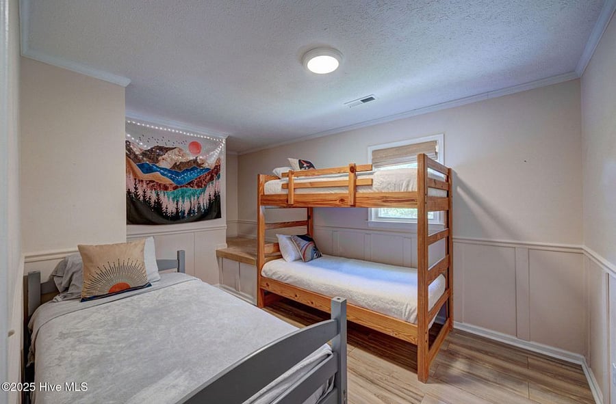 Cozy bunkroom, ideal for kids or additional guests, providing a comfortable and practical sleeping space