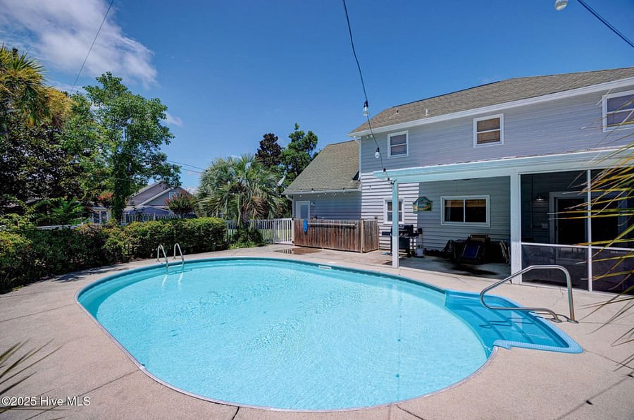 Private pool with lounge seating and a barbecue grill, ideal for relaxing, entertaining, or enjoying sunny coastal days.