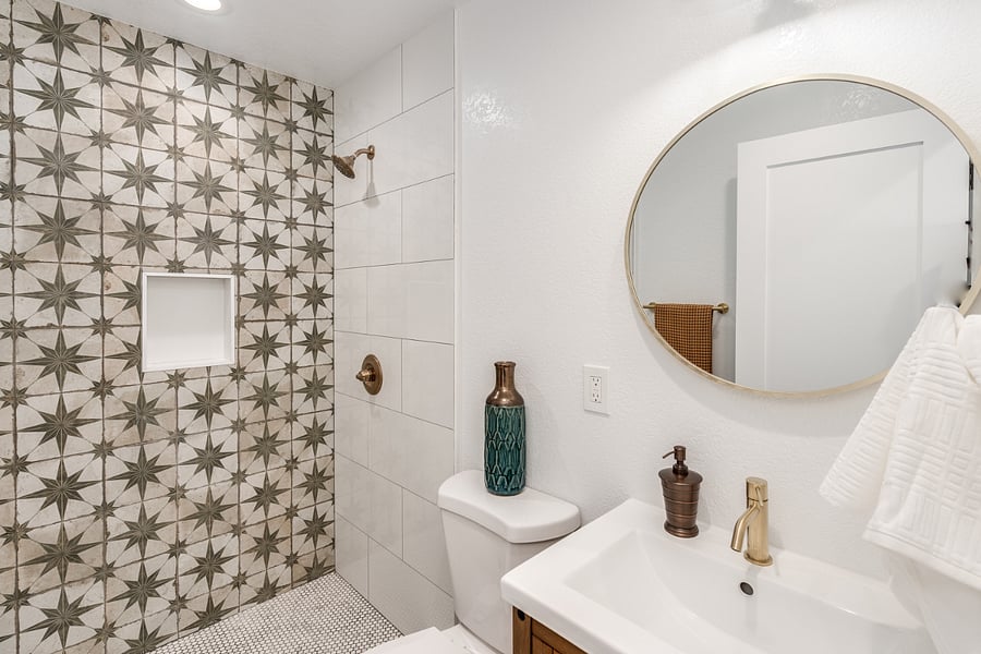 Modern tile design in spanish style bathroom.