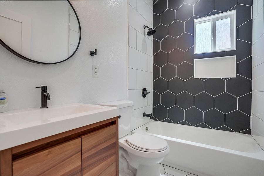 Full bathroom with shower / bath combo.
