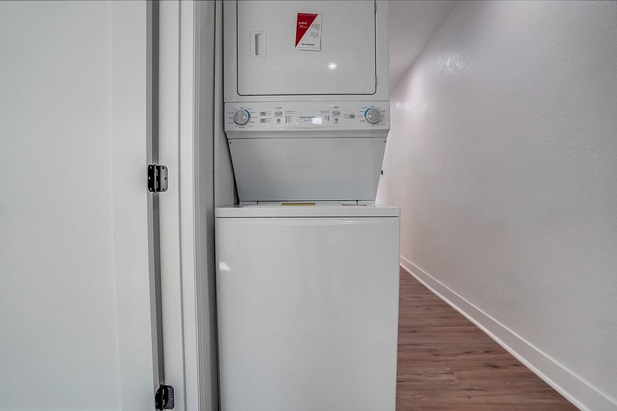 Stackable washer dryer in unit.