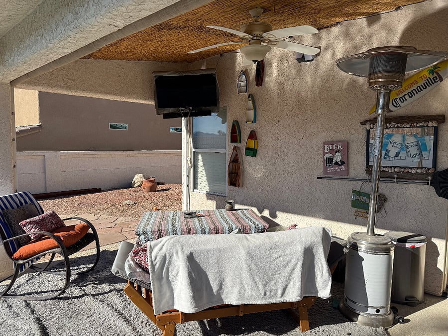 Backyard Patio with TV and Fire Pit Table and Chairs