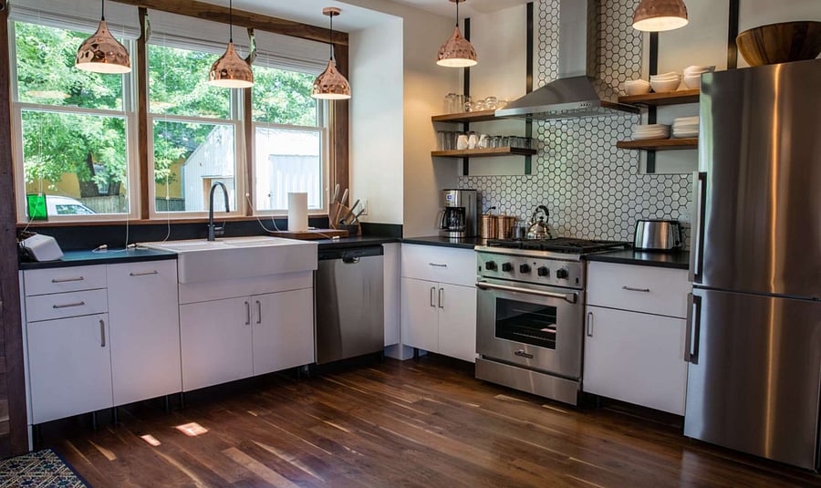 Fresh modern kitchen overlooking the back patio and off street parking.