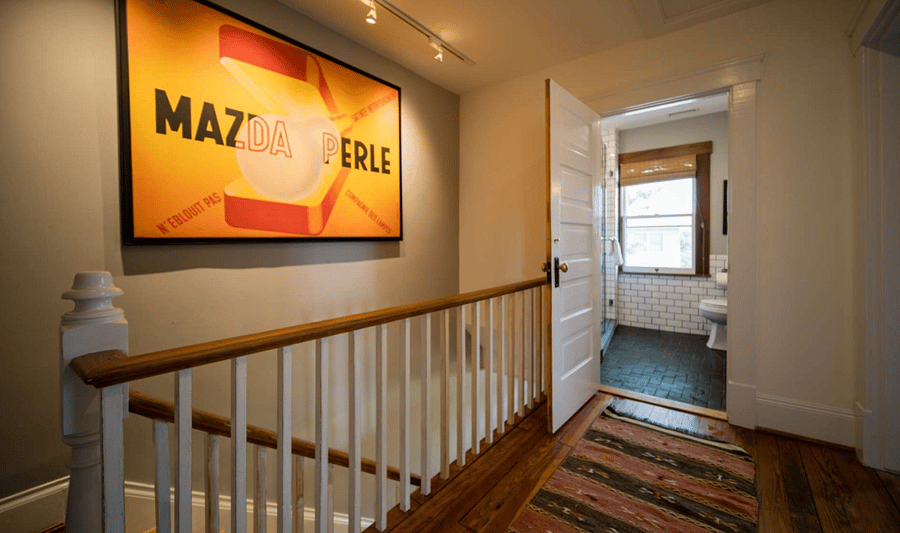 Stairs leading to full bath upstairs and three bedrooms. Separate AC and Heat upstairs.