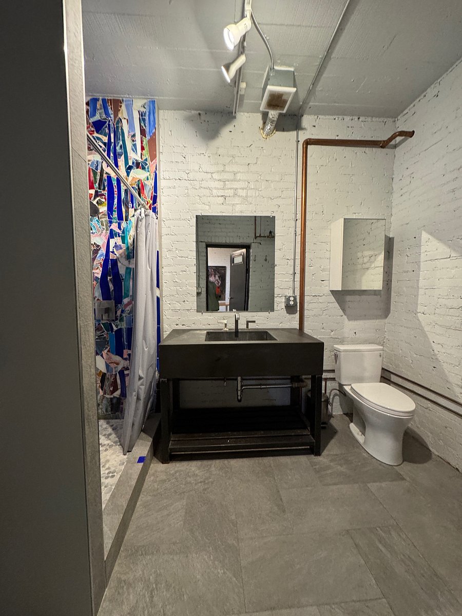 wide-angle of the bathroom, with independent hot water heater.