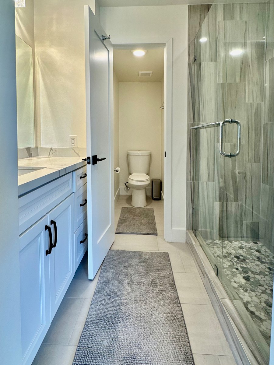 Full ensuite bathroom w/ water closet for privacy and over-sized shower