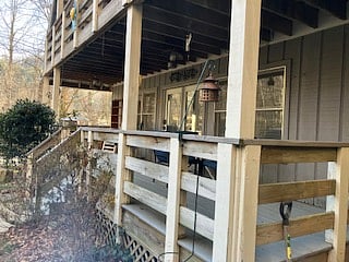 This apartment has a large full-length porch with private gate, and the front door has a self check in coded lock