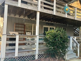 Front view of porch with front access to a dog run, and close to the driveway parking