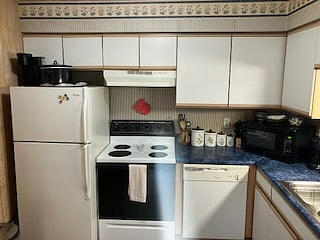 There is a full kitchen with electric stone, full sized fridge, dishwasher, coffee pots, microwave, pots and pans and full serving amenities.