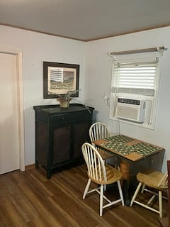 The dining room, is next to both the kitchen and living room area. The dining table sits 3 guests, and there is a breakfast bar (shown in another photo) that seats two more guests.