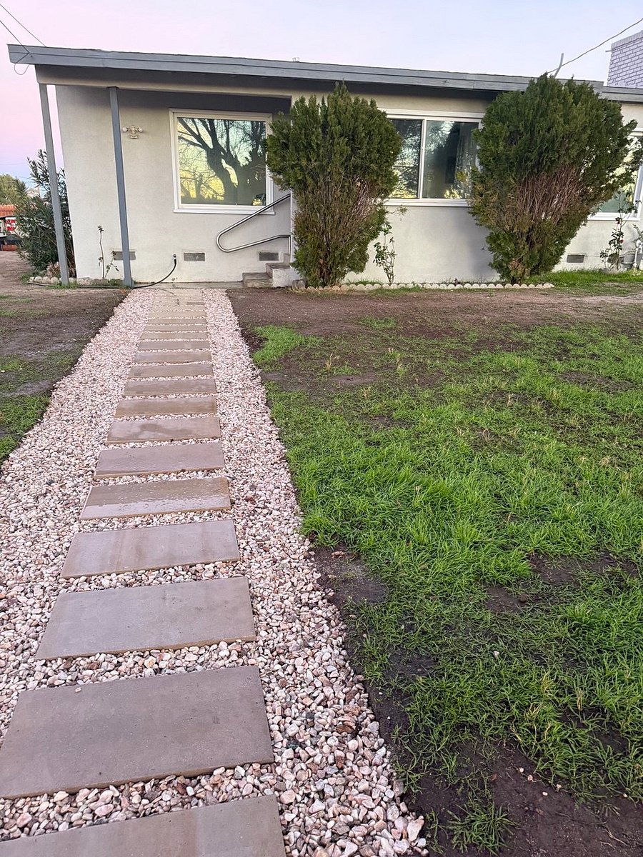 Gated yard with landscaped pathway and outdoor space