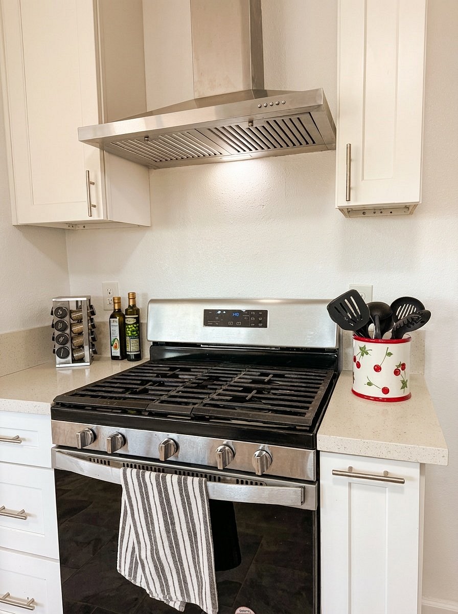 Fully equipped kitchen with gas stove and cooking essentials