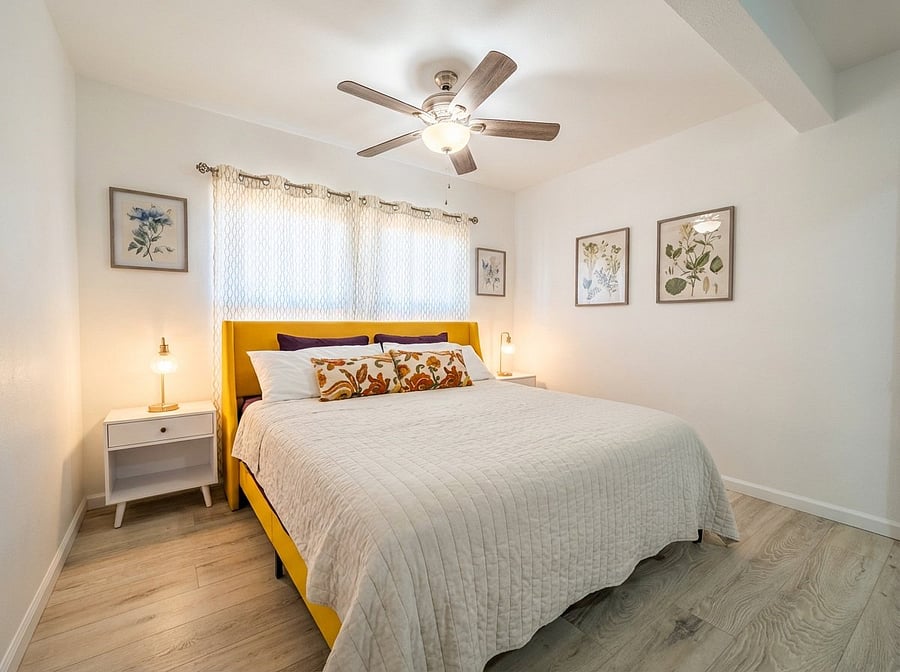 Primary bedroom with King bed, premium linens, and bedside lamps