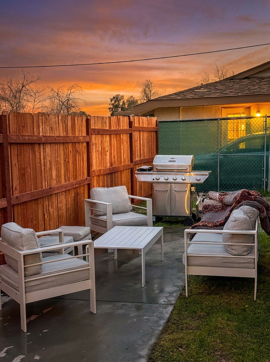 Private backyard with BBQ grill and outdoor seating