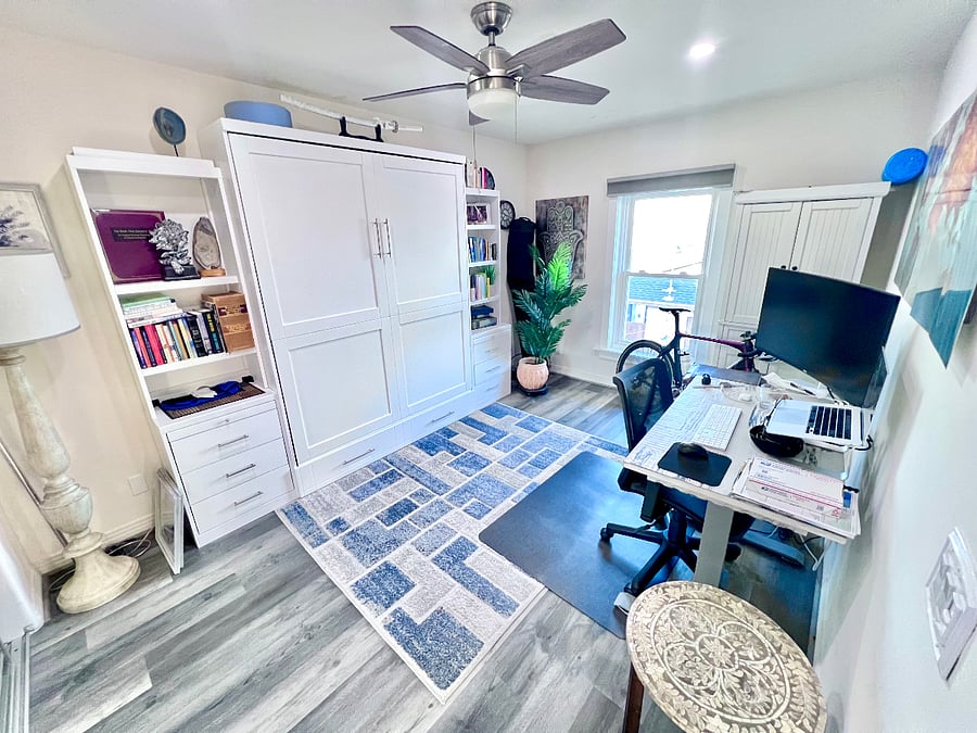 Comfy Queen Murphy Bed for functionality so guests can enjoy private work station as well