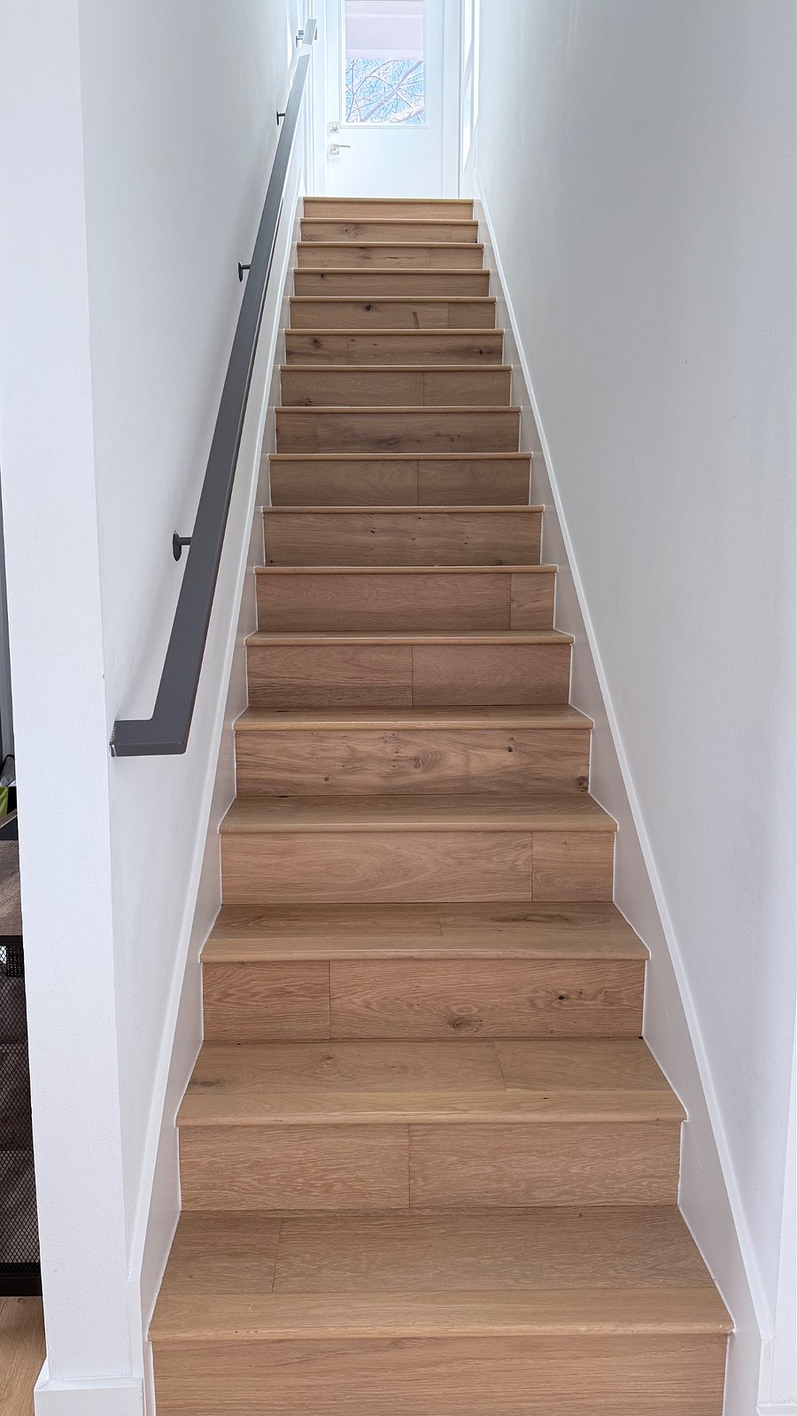 Stairs to a private primary bedroom.