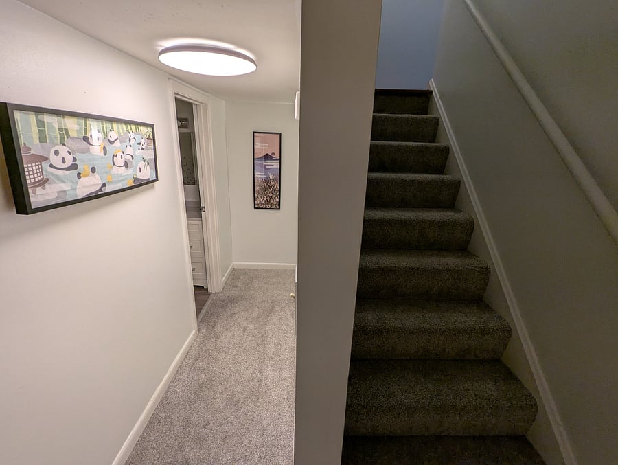 Second floor staircase up to living/kitchen space