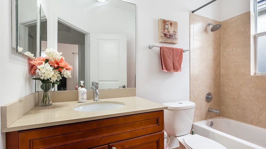 Common bathroom with full bathtub and shower