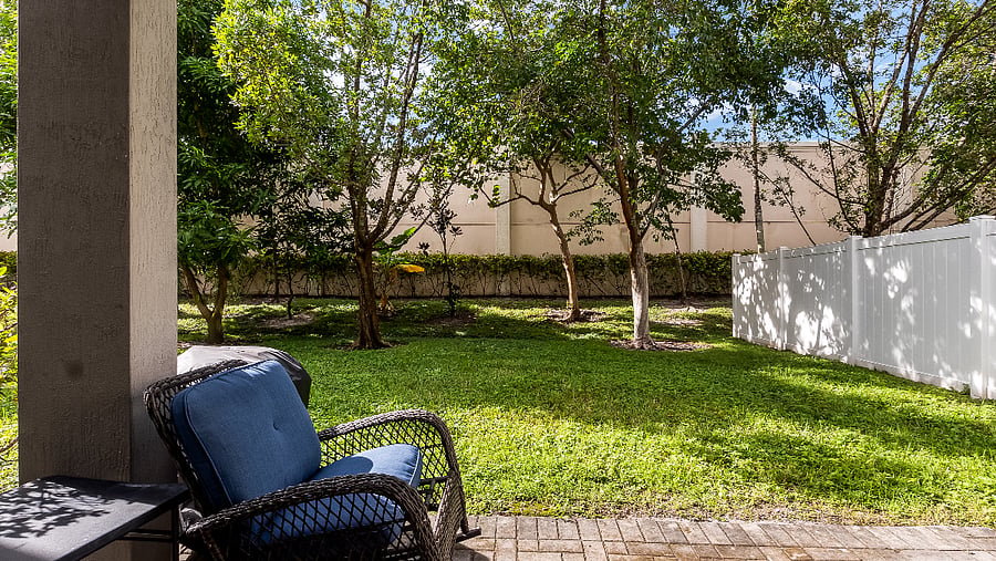 Spacious backyard with patio and bbq grill.