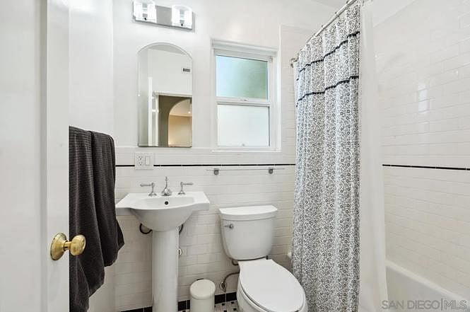 bathroom with shower and tub