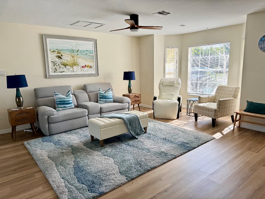 Living room with reclining sofa & 0 gravity massage chair