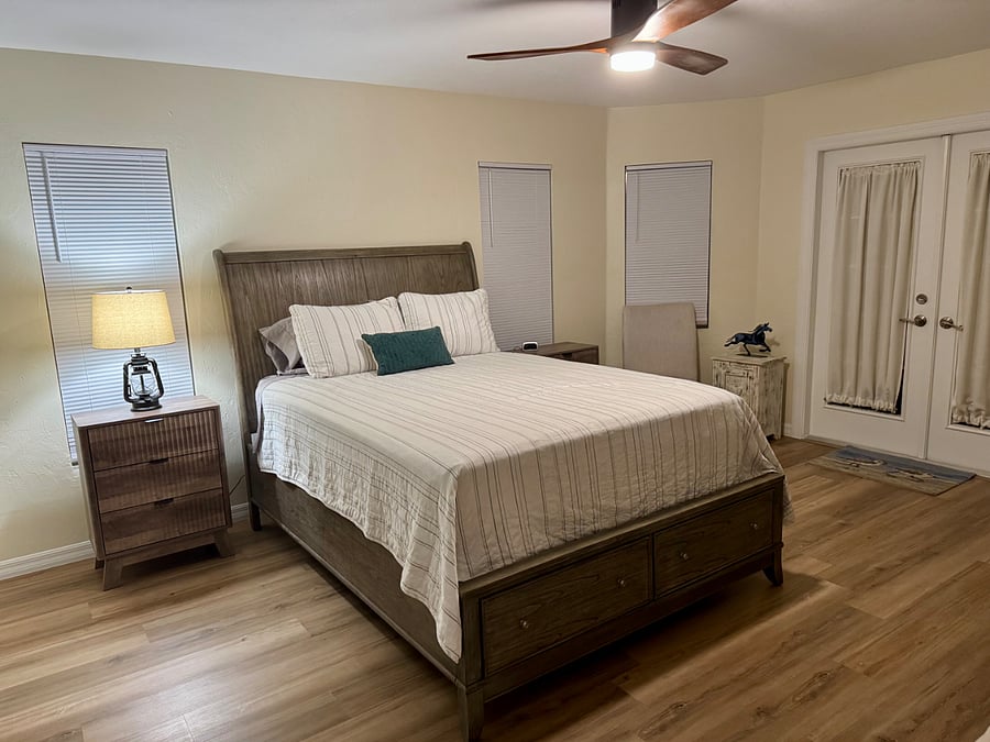 Master bedroom 1 with walk in closet and dressing room chair