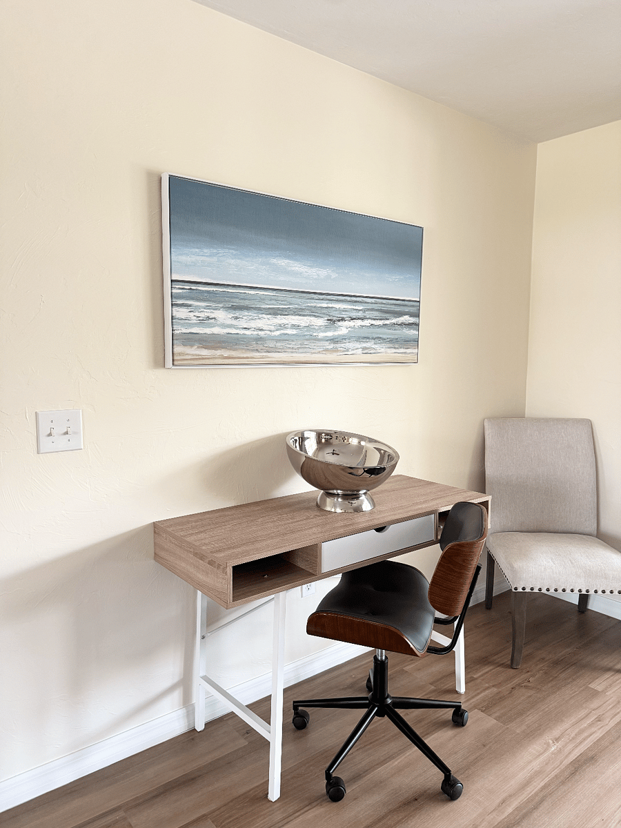 Desk and rolling office chair in the dinette area