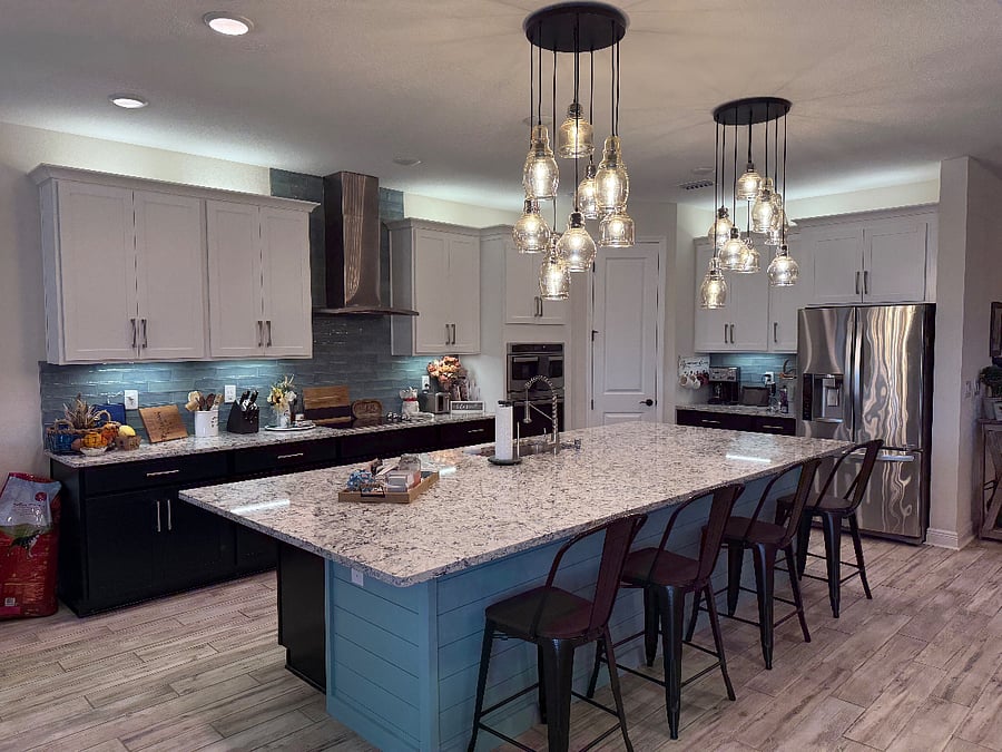 Extra-large shared kitchen with a 12-foot island perfect for preparing anything your heart desires. Opens to the living room.