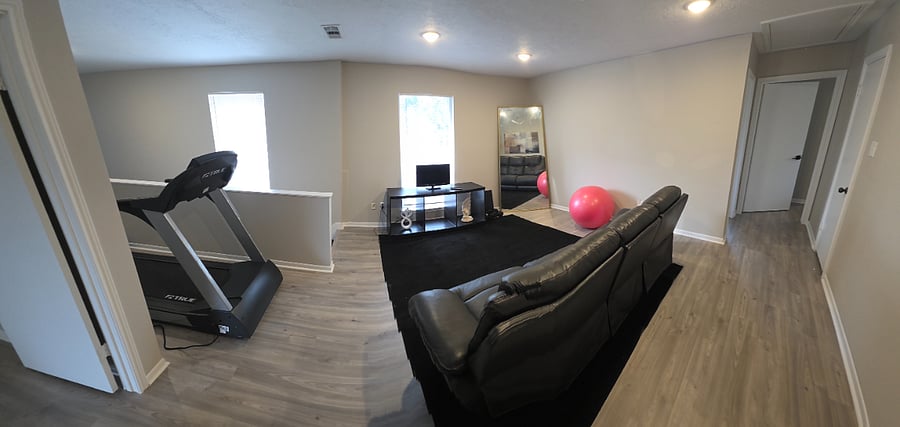 2nd floor living area with treadmill