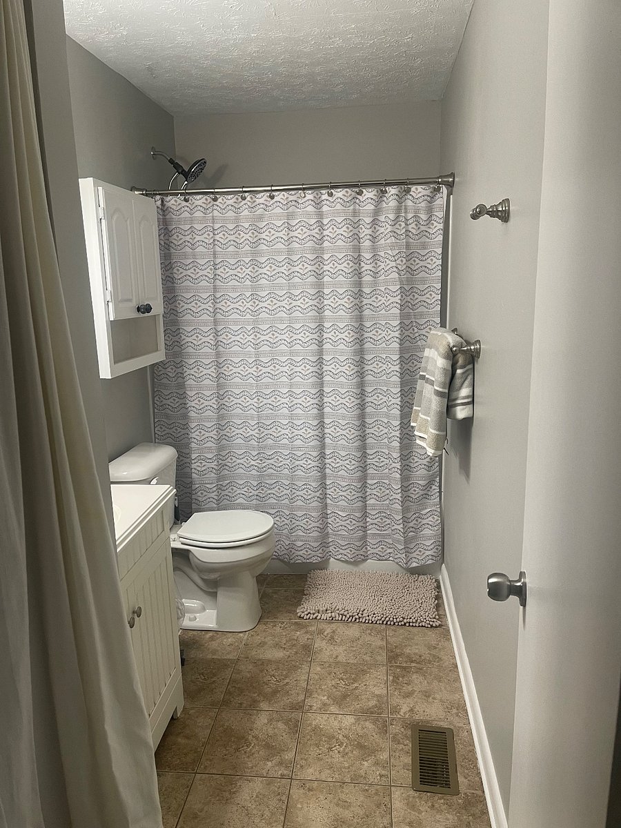 The bathroom is equipped with an ample supply of bath towels and spare linens, blow dryer, first aid kit. The tub and shower surround are brand new.