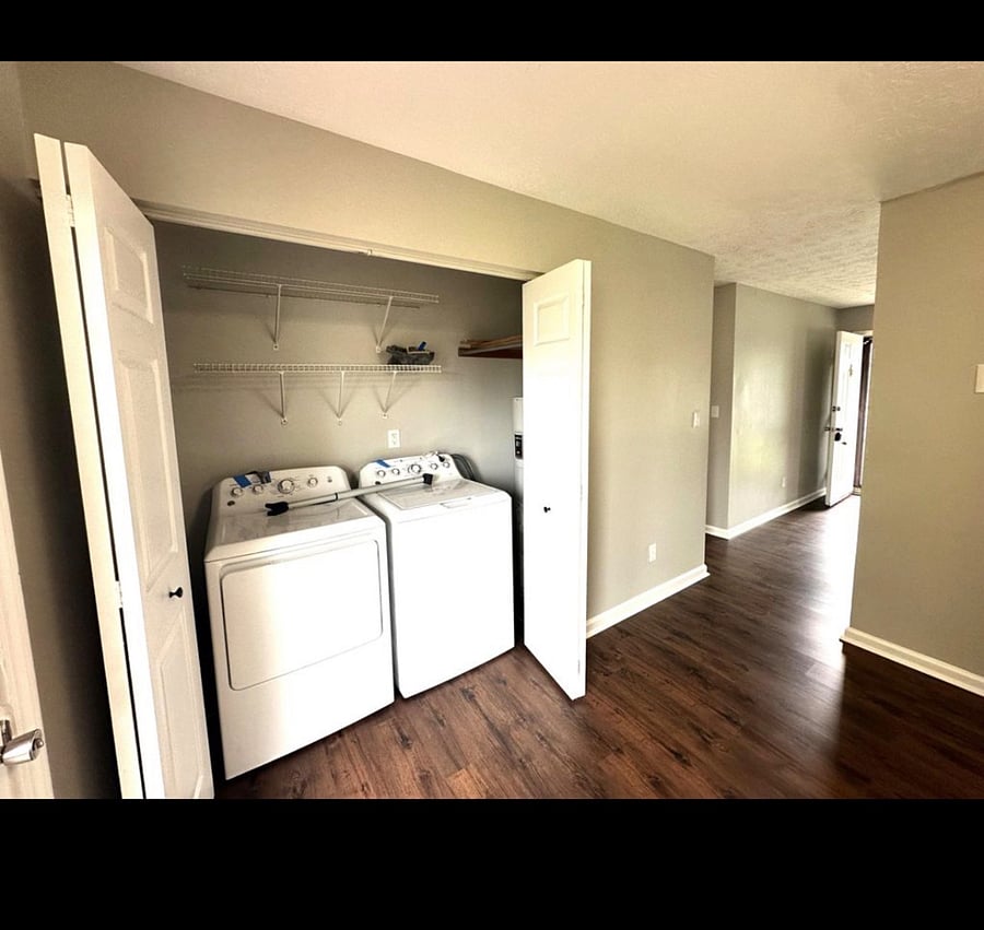 Home is furnished with a washer and dryer off of the kitchen.