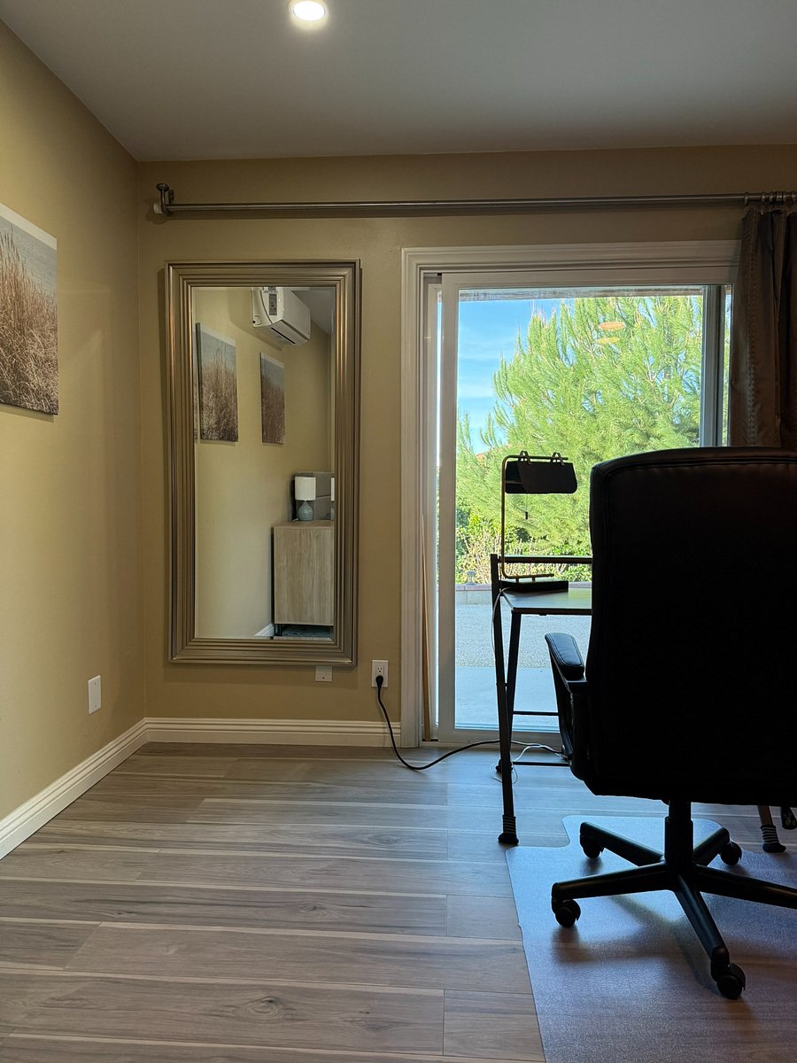 Hidden mirror behind curtains making flexible layout