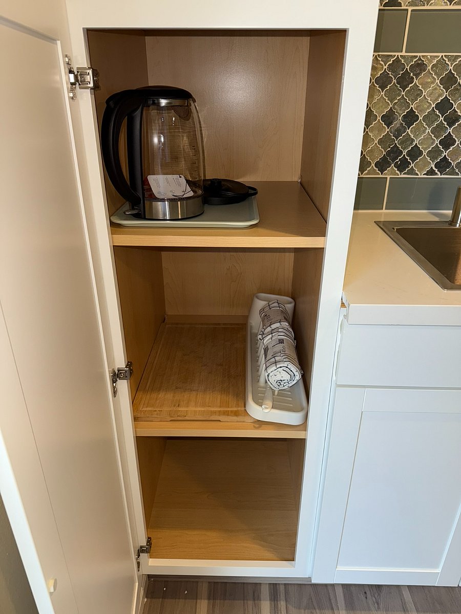 Hot water kettle and slim drain rack for dishes along with towels