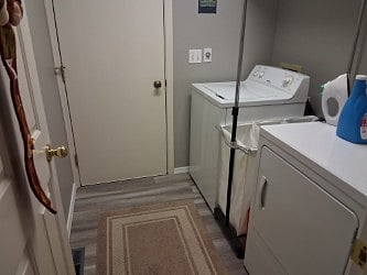 Shared laundry room with homeowner