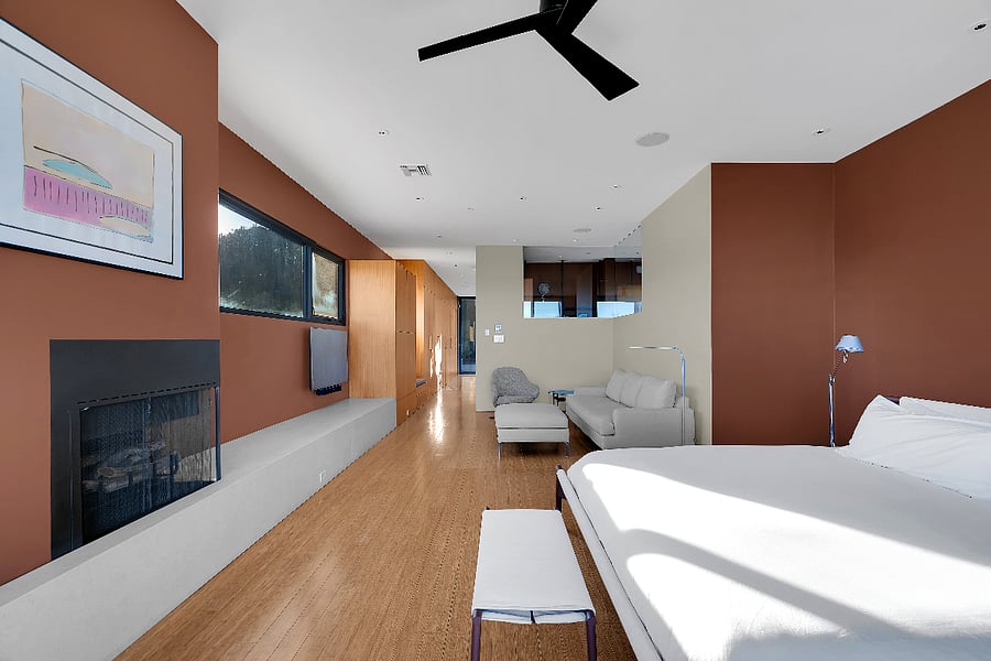 Alternate view of the primary suite highlighting scale, light, and desert serenity.