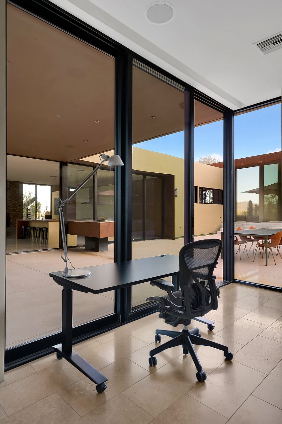 Second work area overlooking the central courtyard, ideal for focused work or creative time.