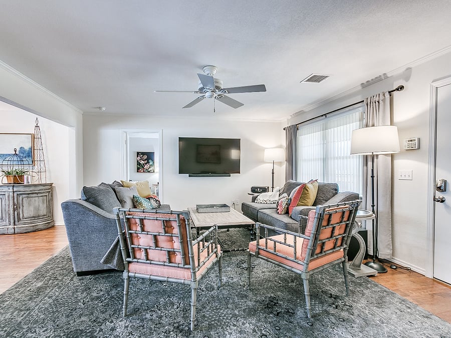 Living room with 65" modern smart TV.