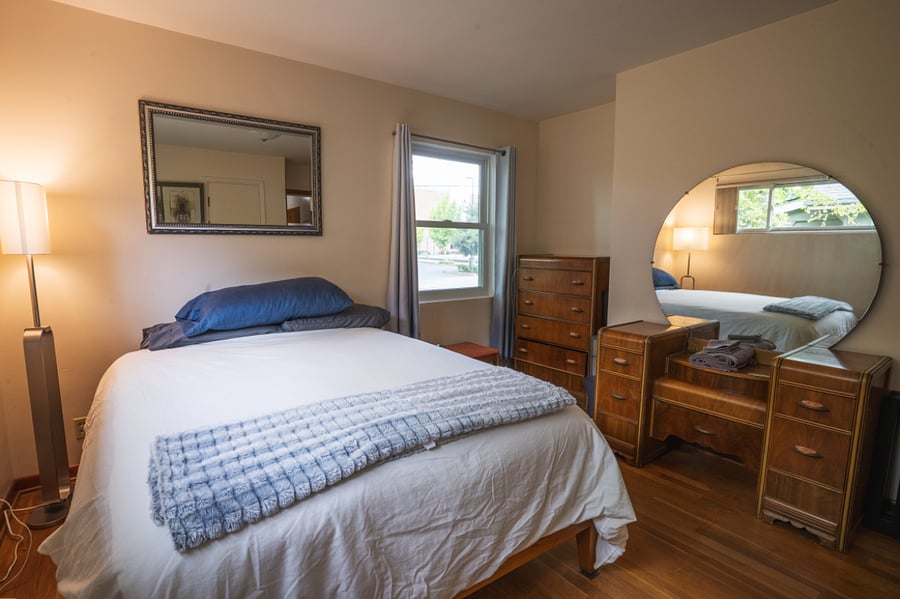 Main floor east bedroom, queen bed