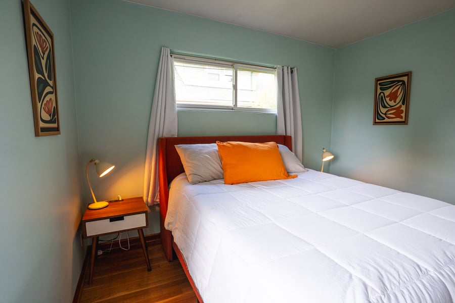 Main floor west bedroom, queen bed.