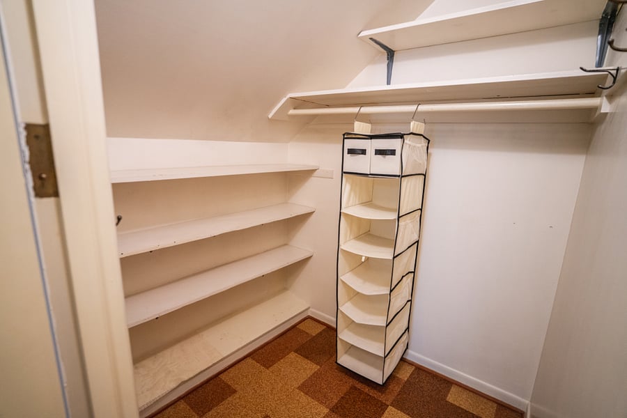 Walk-in closet, upstairs, east bedroom/aka office space.
