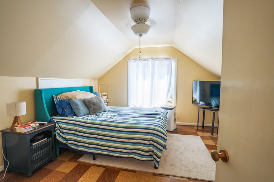 Upstairs, west bedroom, window A/C and ceiling fan.