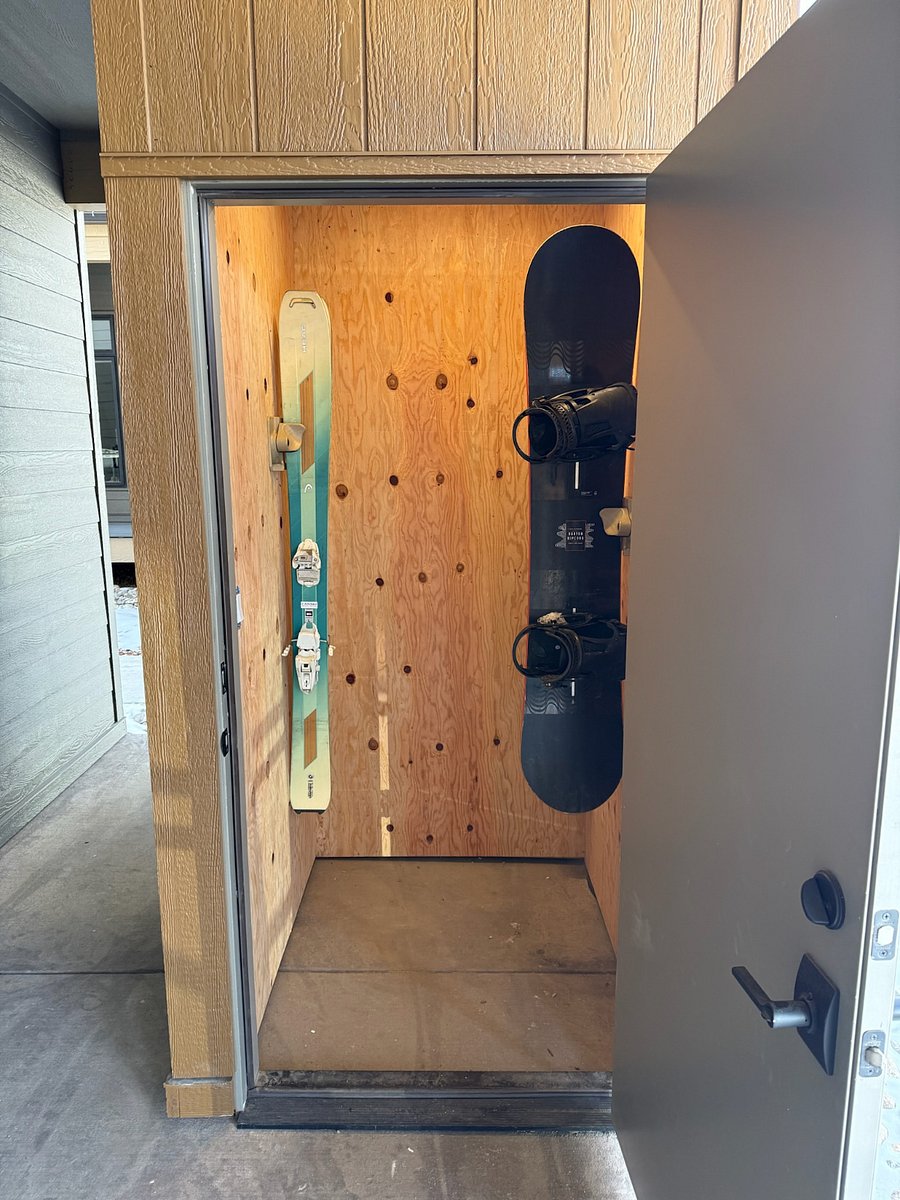 Private storage closet with ski/board mounts in winter and bike mounts in summer 