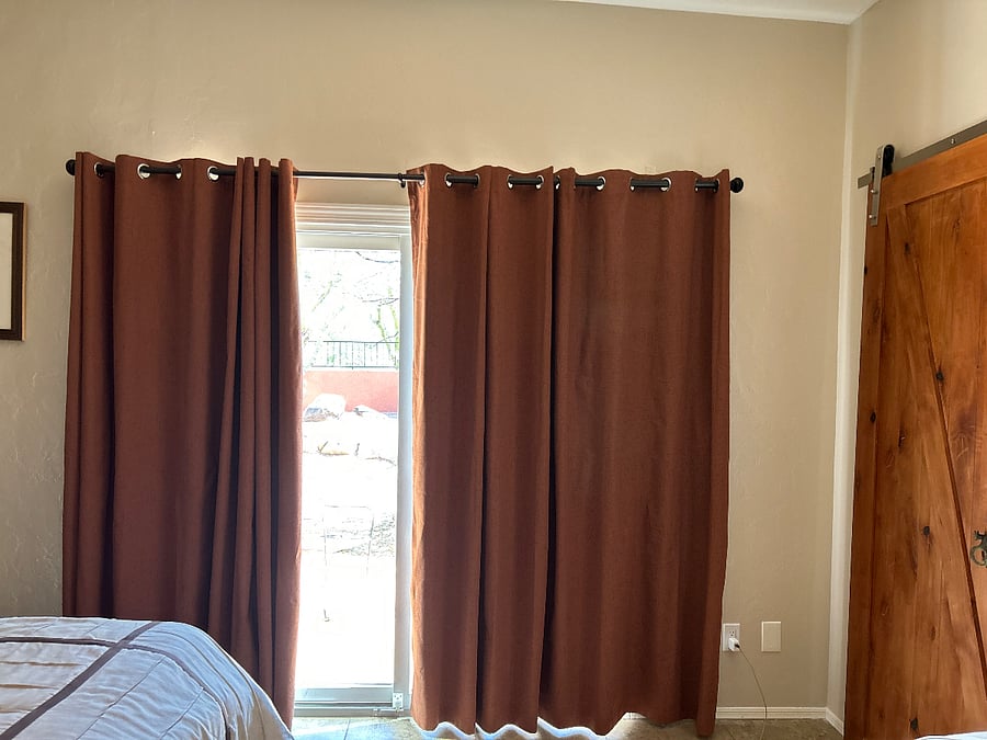 Master black out curtains over slider to pack patio