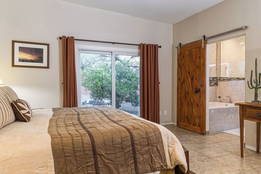 Master sliding glass door to patio and citrus trees
