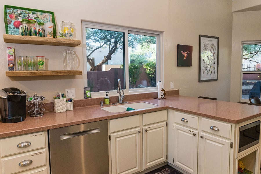 Kitchen with all needed dishwater, dishwasher, disposal, kuerig coffee maker, eating bar
