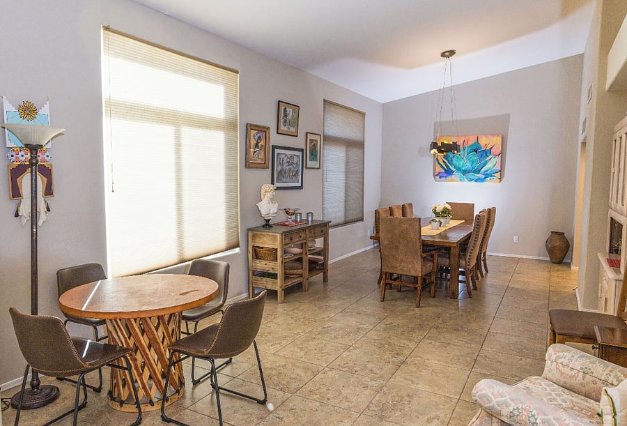 game table in sitting area and dining room beyond